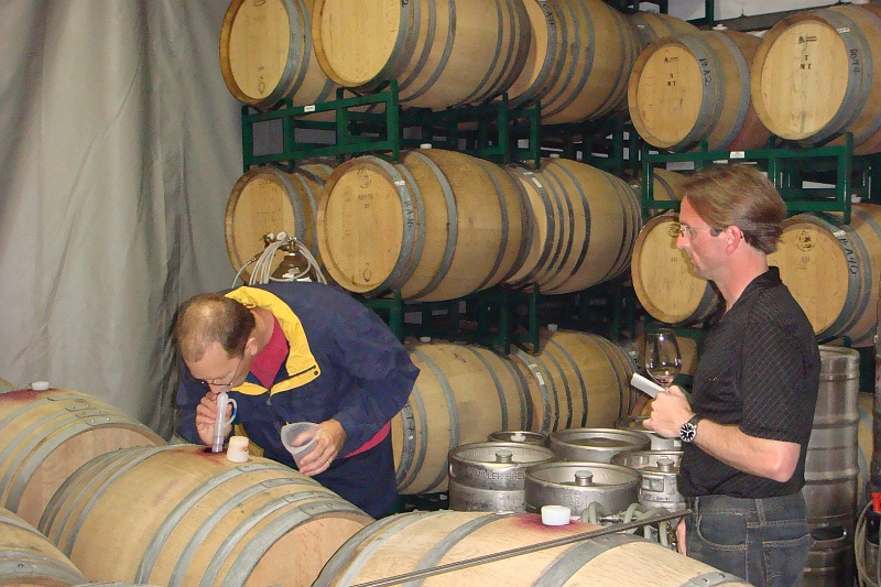 97.JPG - Steve with Mike Officer of Carlisle doing a barrel tasting.
